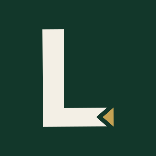 Official ivory L with its separate gold triangular dot on a deep green app tile